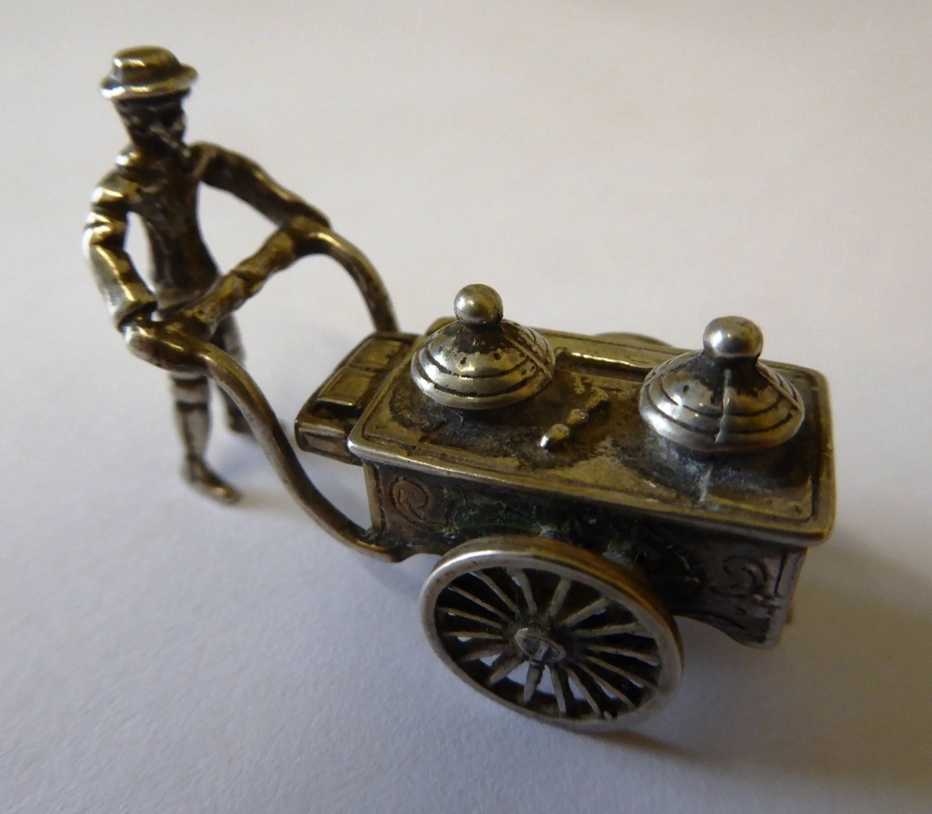 Very small model of a street vendor and handcart marked with Dutch silver hallmark, CS3; approx 4cms - Image 3 of 3