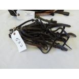 12 assorted brow bands of various sizes and 20 cheek pieces for riding bridles of various length/