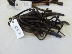 12 assorted brow bands of various sizes and 20 cheek pieces for riding bridles of various length/