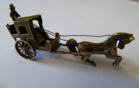 Very small model of a Hansom Cab and driver marked with Dutch silver hallmark dated 1978, approx.