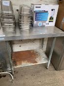 Stainless steel prep table and shelf.