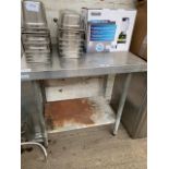 Stainless steel prep table and shelf.