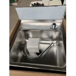 Stainless steel handwash sink and taps.