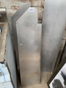 Stainless steel wall shelves with brackets.