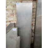 Stainless steel wall shelves with brackets.