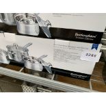 Set of 3 saucepans with lids.