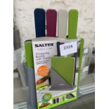 Salter 4 piece set of coloured coded chopping boards in stand.