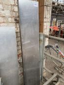 Stainless steel wall shelves with brackets.