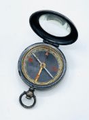 Travel compass in white metal case, and an Orvis pocket watch