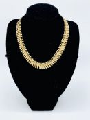 9ct gold flat necklace, length 42cms, weight 19.1gms.
