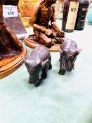 Two brass elephants, an aluminium sailing boat, and two Maori wood carvings.