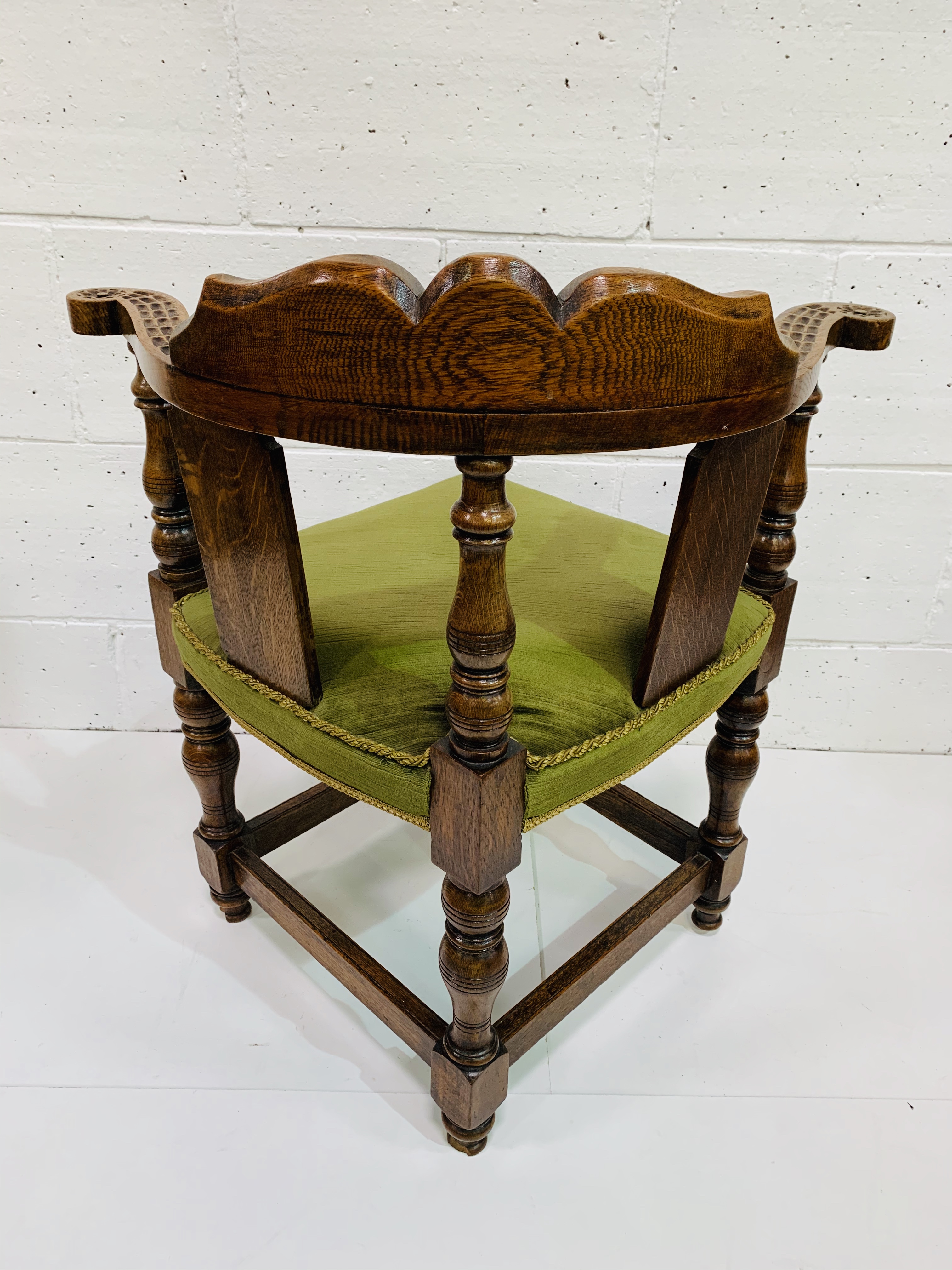 Oak framed corner chair, heavily carved, with green upholstered seat. - Image 5 of 5