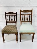 Two mahogany framed Edwardian rail back chairs with upholstered seats.