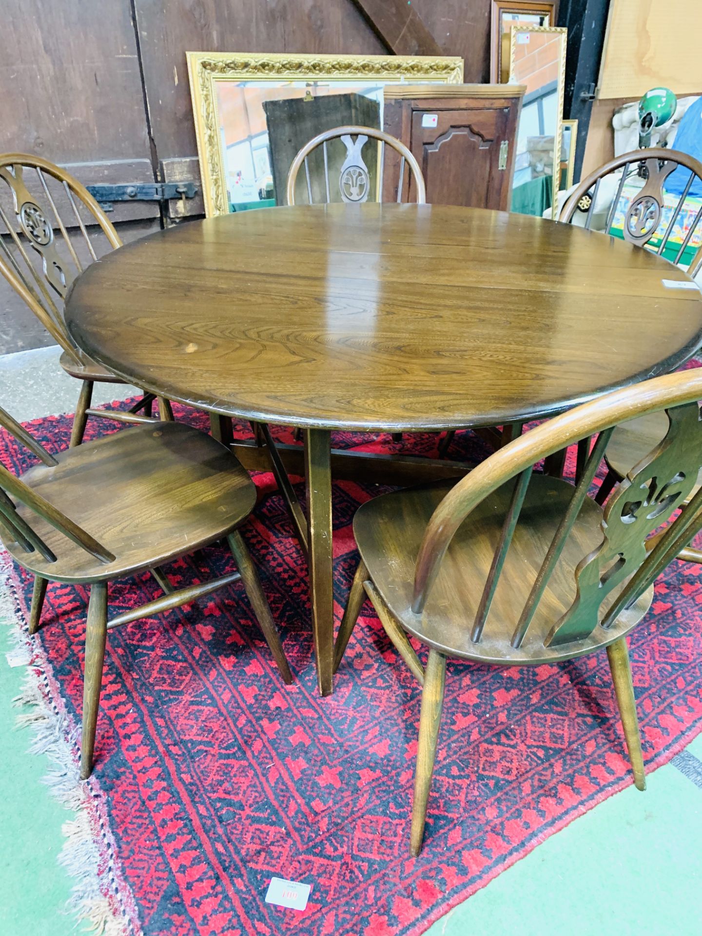 Ercol drop side dining table together with six Ercol Windsor style chairs. - Image 2 of 5