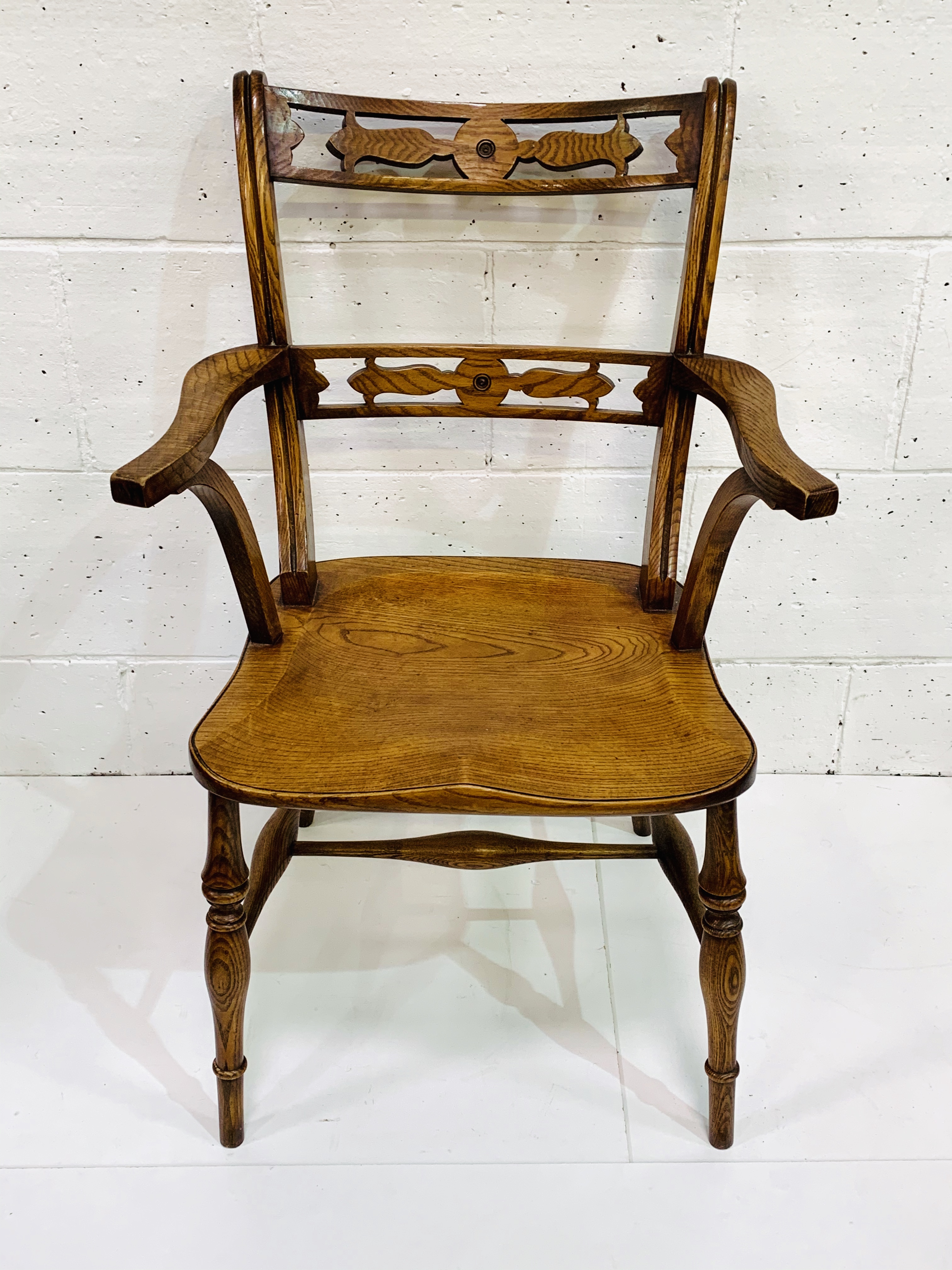 Arts and Crafts style oak and elm open arm chair.