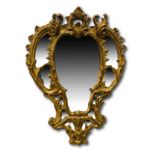 Georgian wall mirror with ornately carved gilt plaster frame