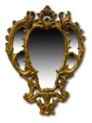 Georgian wall mirror with ornately carved gilt plaster frame