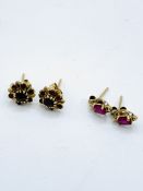 A pair of 9ct garnet earrings and 9ct ruby set earrings.