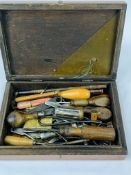 Wooden box containing a quantity of hand tools together with a tin of metal ware including rowelled