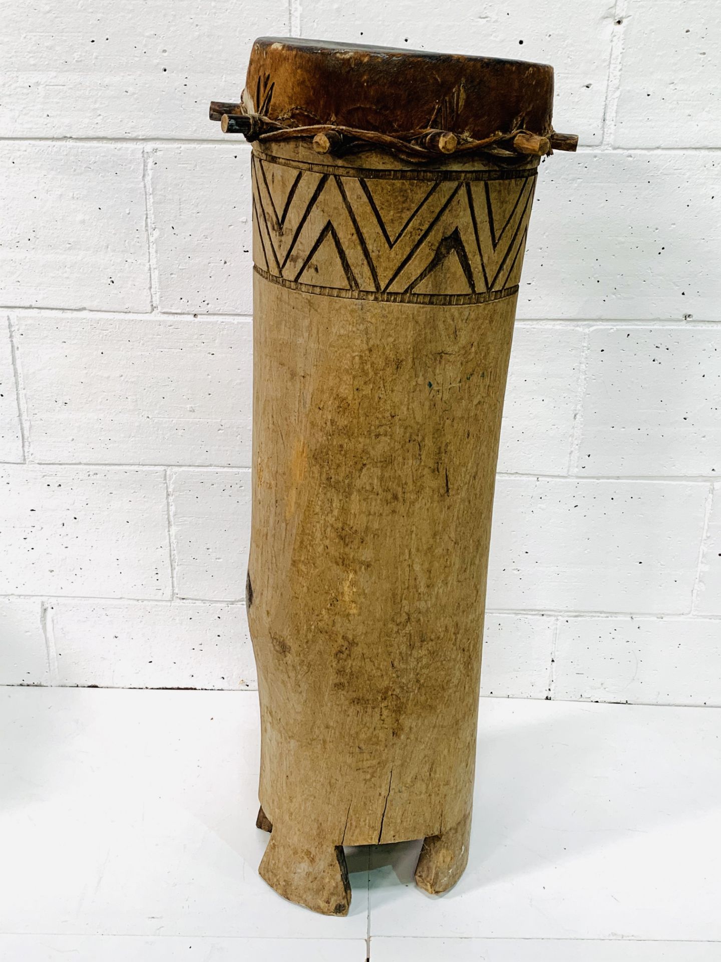 Large African drum carved from a tree trunk.
