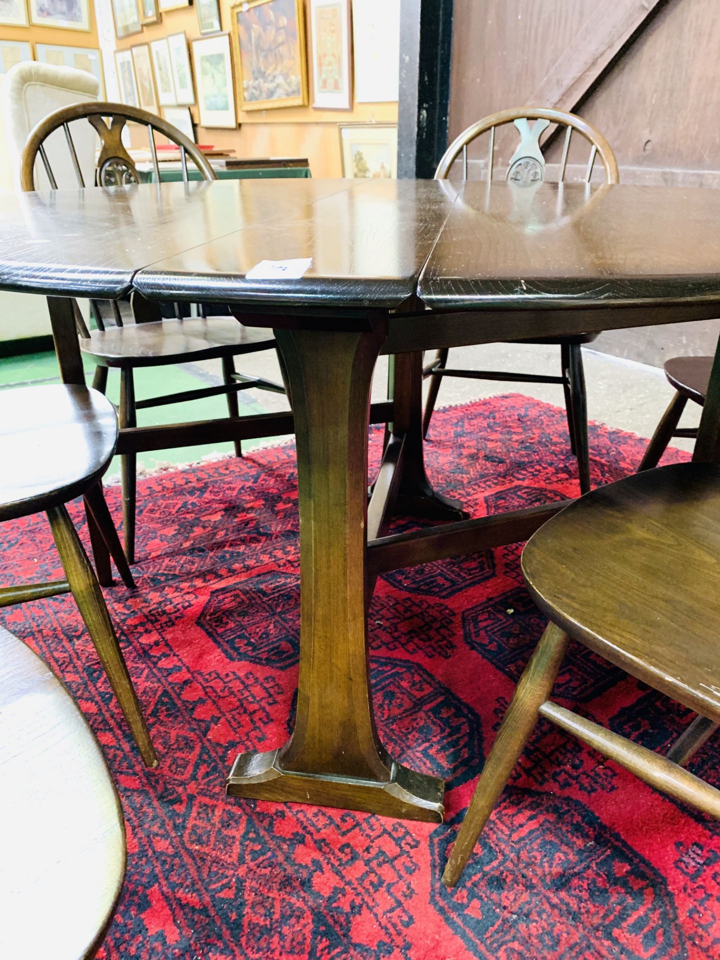 Ercol drop side dining table together with six Ercol Windsor style chairs. - Image 5 of 5