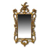 Two Georgian wall mirrors with ornately carved gilt plaster frames