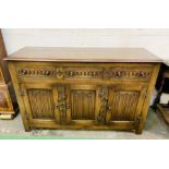 1930's oak sideboard with three frieze drawers over three cupboards.