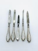 Four hallmarked silver handled manicure set and one other.