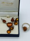 Silver-mounted amber necklace, earrings and ring set.