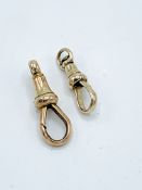 A pair of 9ct gold clip hooks for watch fobs.