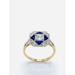 Diamond and blue enamel ring.