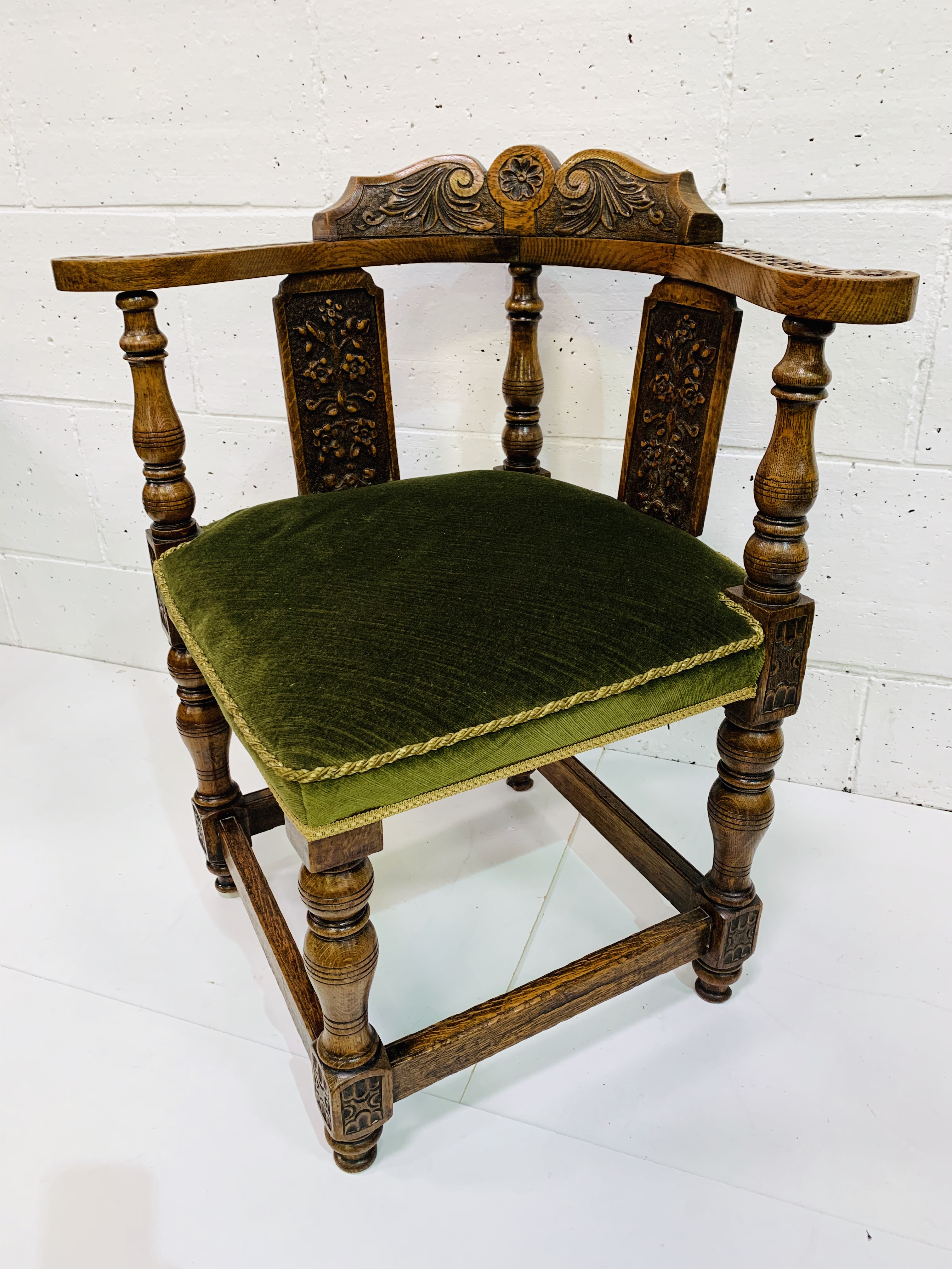 Oak framed corner chair, heavily carved, with green upholstered seat. - Image 3 of 5