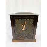 Oak cased mantel clock with copper face carved to face "East, West, Hames Best" by D. C. Co.