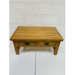 Oak low table with two double-sided frieze drawers, with slatted sides.
