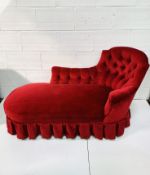 Red velour upholstered buttoned back chaise longue.