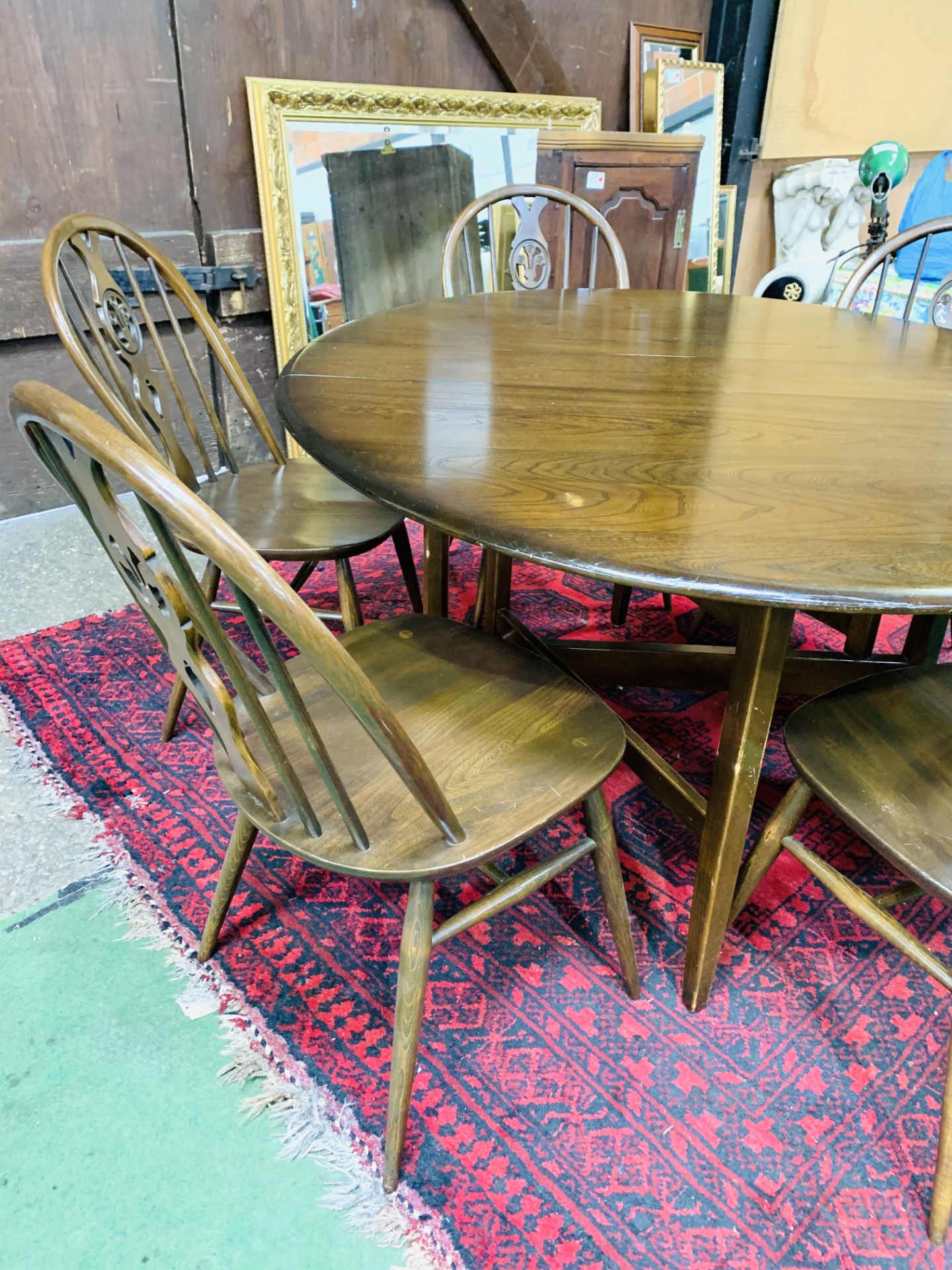 Ercol drop side dining table together with six Ercol Windsor style chairs. - Image 3 of 5