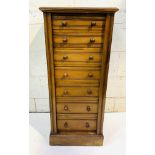 Mahogany Wellington chest of seven graduated drawers, complete with key.