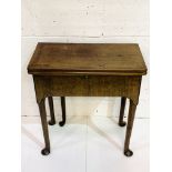 Mid-18th century mahogany side table with gate leg and fold over top.