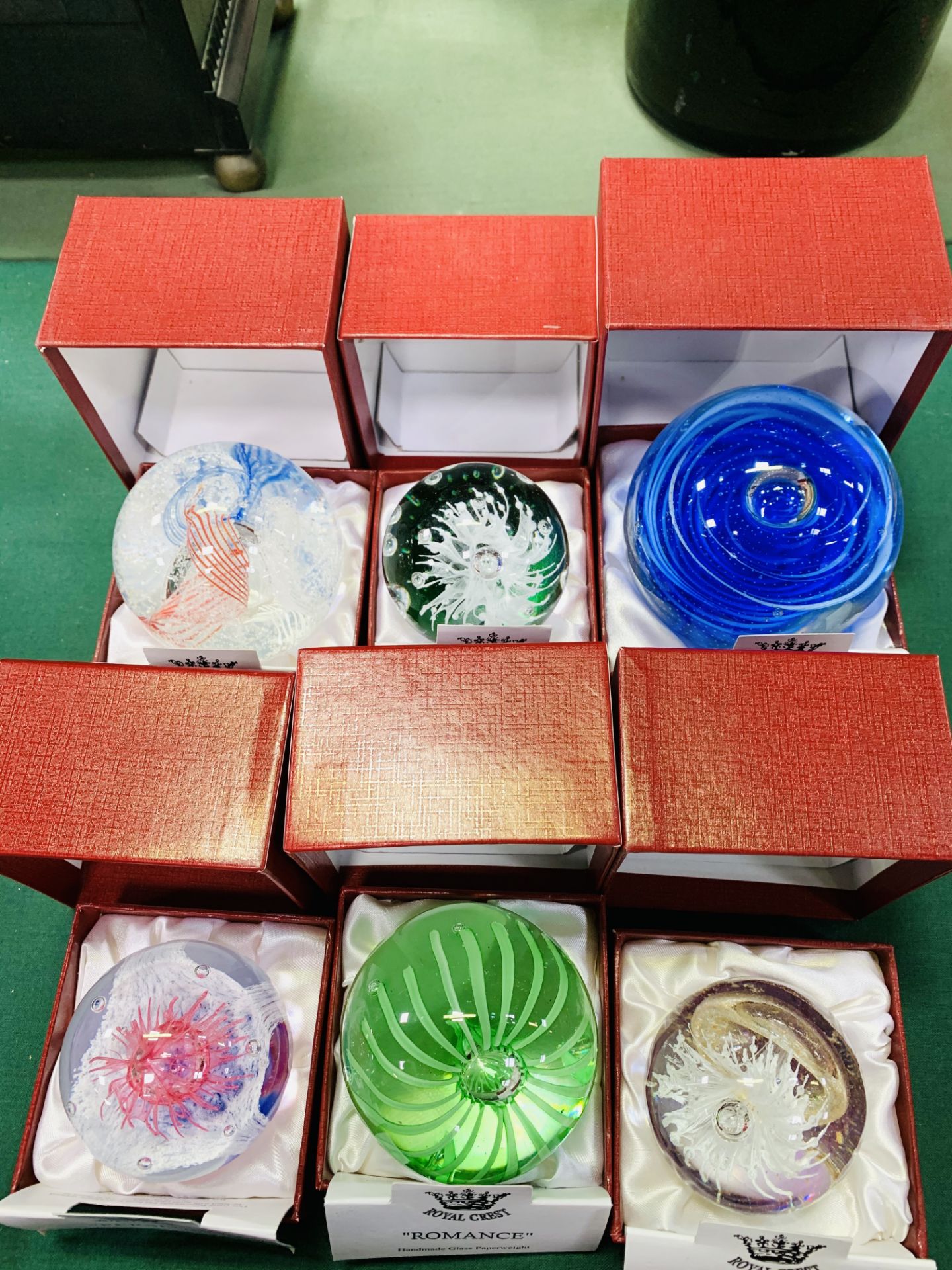 Six Royal Crest paperweights, 2 crystal animal figures and a silver plate salt and pepper.