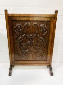 Oak fire screen carved with tulips.