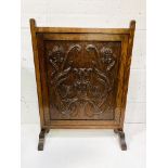 Oak fire screen carved with tulips.