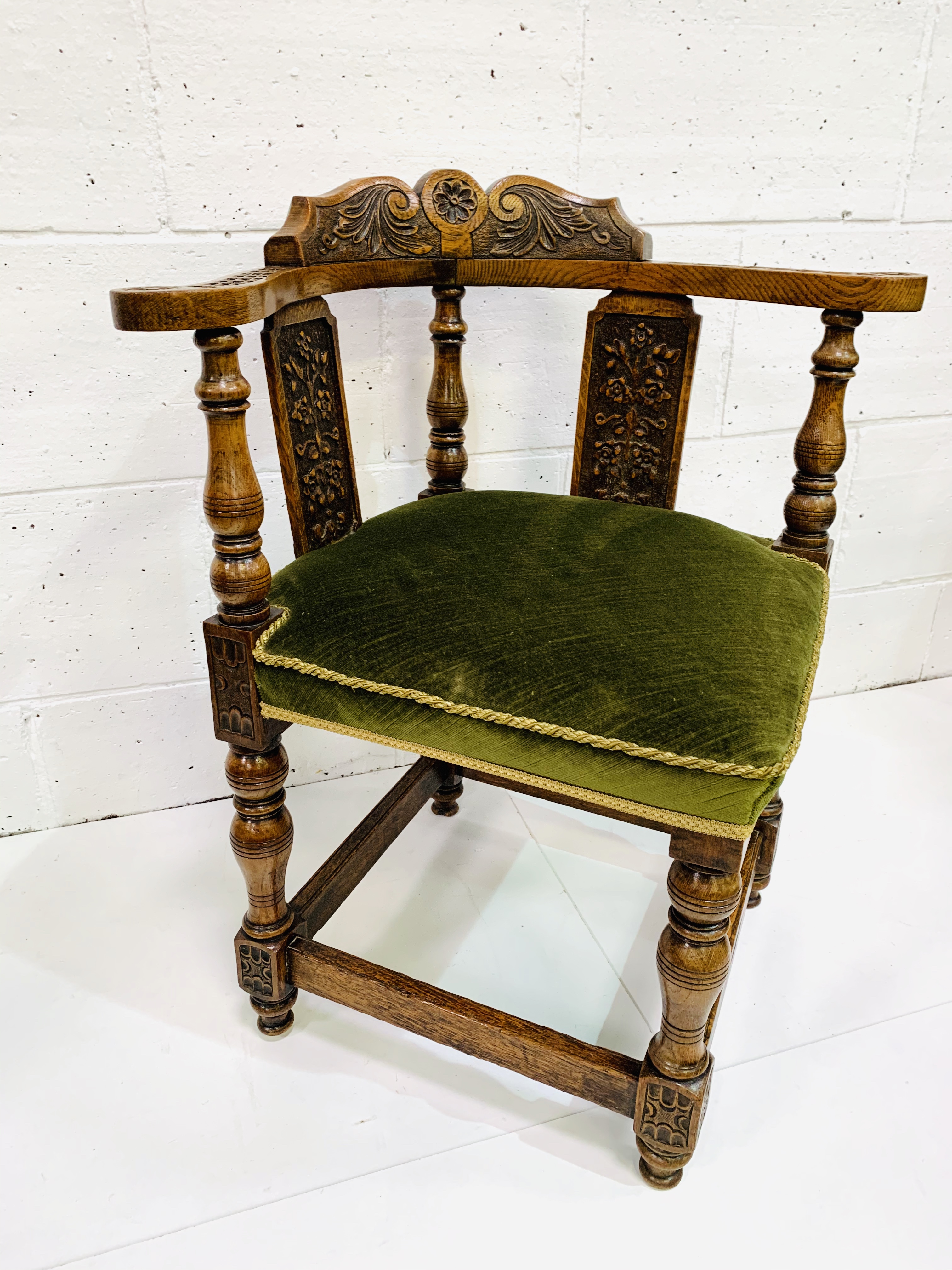 Oak framed corner chair, heavily carved, with green upholstered seat. - Image 4 of 5
