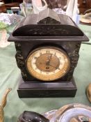 Silver plated tea set together with two mantel clocks.