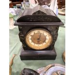 Silver plated tea set together with two mantel clocks.