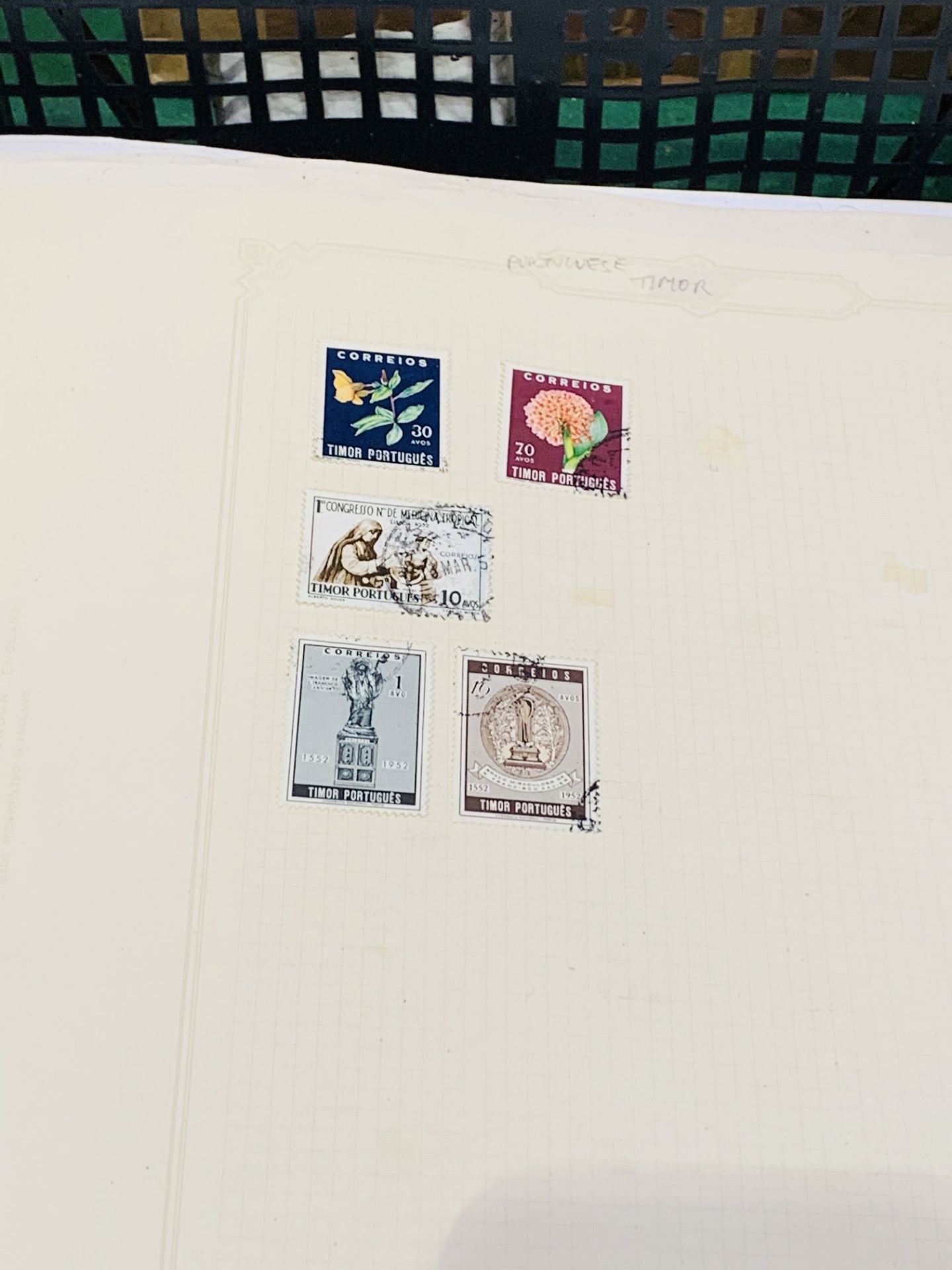 A large quantity in a black tray of world stamps on pages. - Image 3 of 4