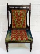 French Mahogany 19th Century nursing chair with original fabric.