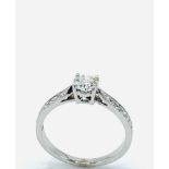 White gold solitaire diamond ring.
