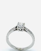 White gold solitaire diamond ring.