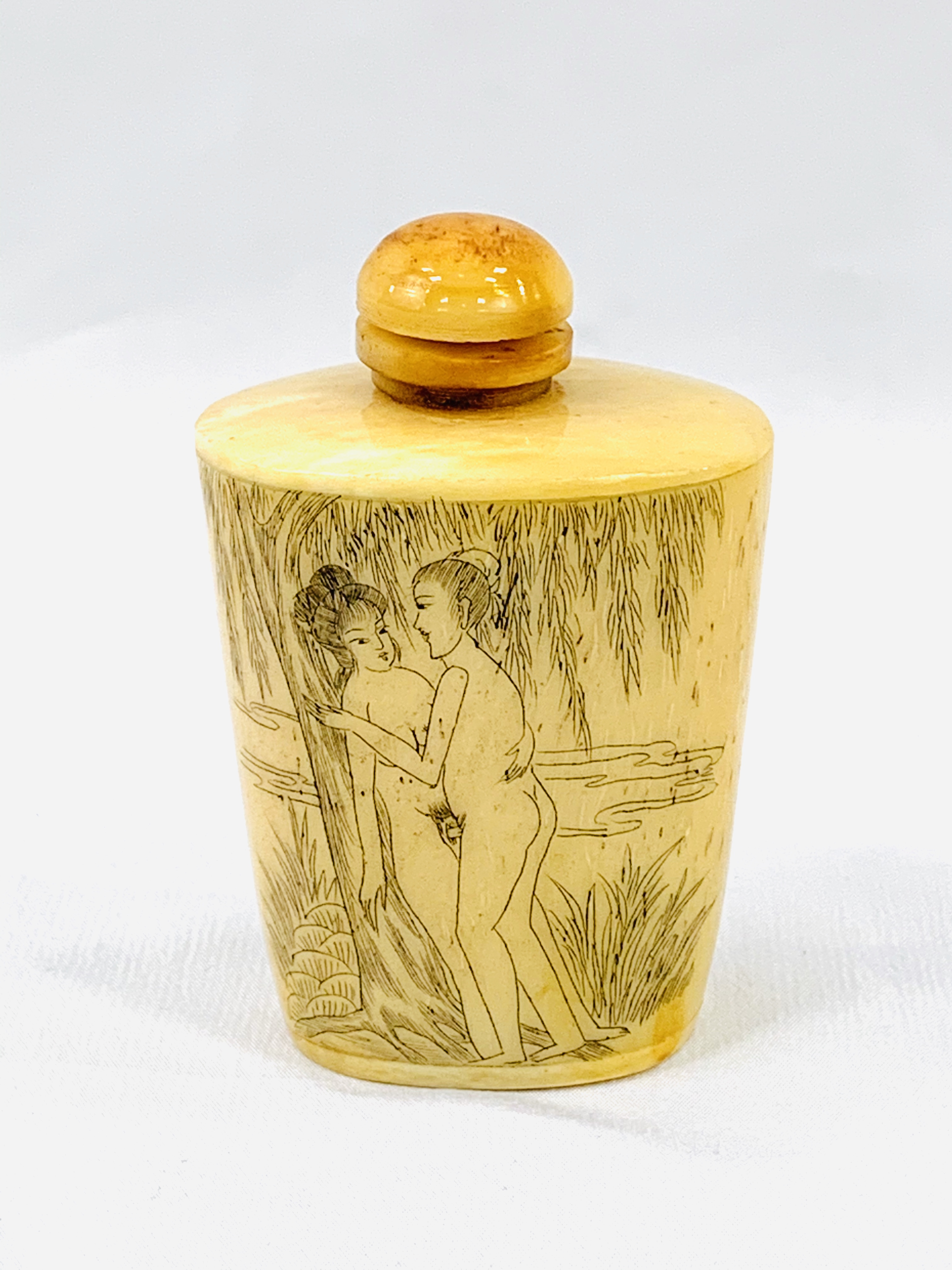 Cone shaped Chinese snuff bottle with dipper, featuring an erotic scene.