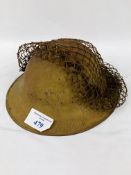 WWII Firewatcher's helmet with original camouflage webbing, stamped 741 and PSC in a triangle